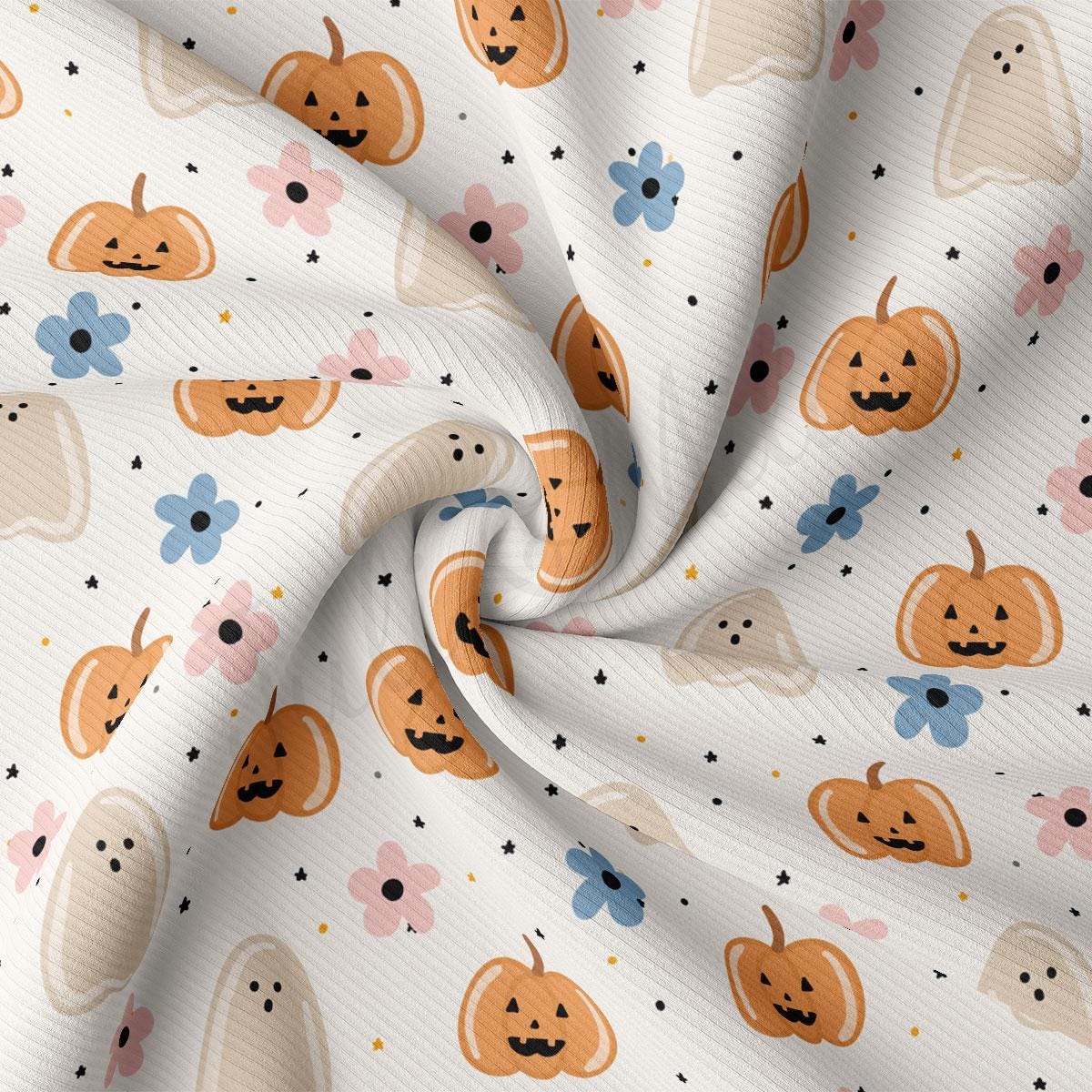 a close-up view of a fabric with a repeating pattern of Halloween-themed pumpkins and ghost shapes.
