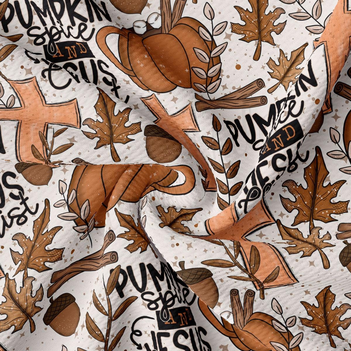 The image is a close-up of a fabric with a repeating pattern of autumn-themed elements, including pumpkins, leaves, and spices. The pattern is predominantly brown and orange, with some black text and illustrations.
