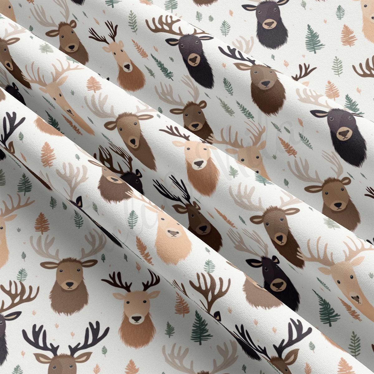 a pattern of deer and pine trees on a white background