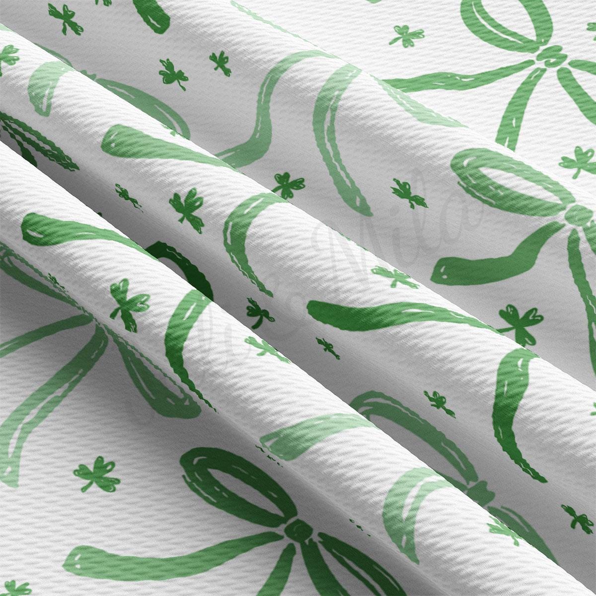 a close up of a green and white wallpaper