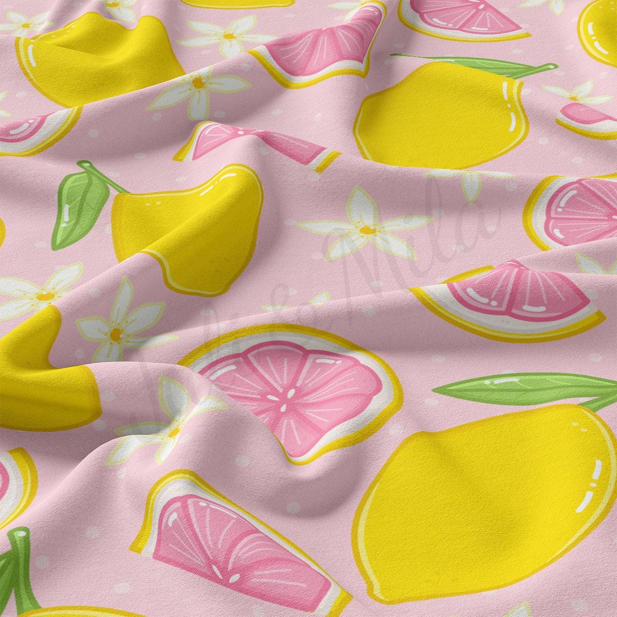 a pink and yellow fabric with lemons and limes on it