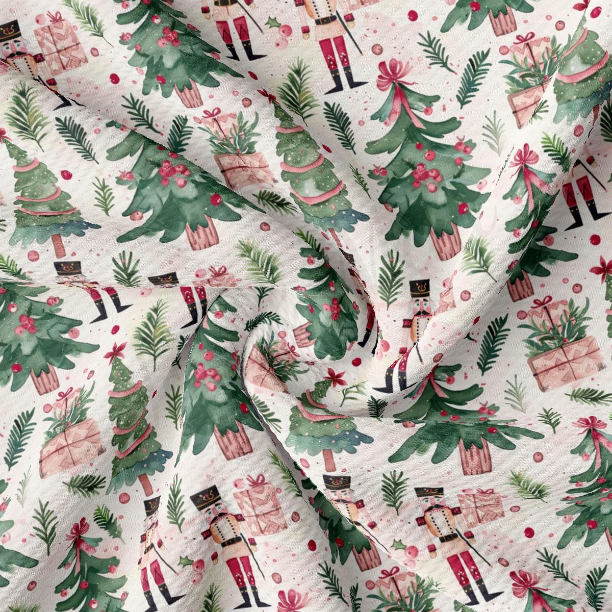 The image is a close-up of a fabric with a repeating pattern of Christmas trees, nutcrackers, and presents.