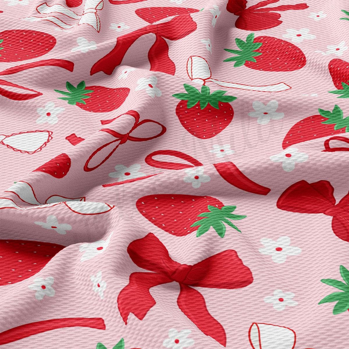 a close up of a pink fabric with strawberries on it