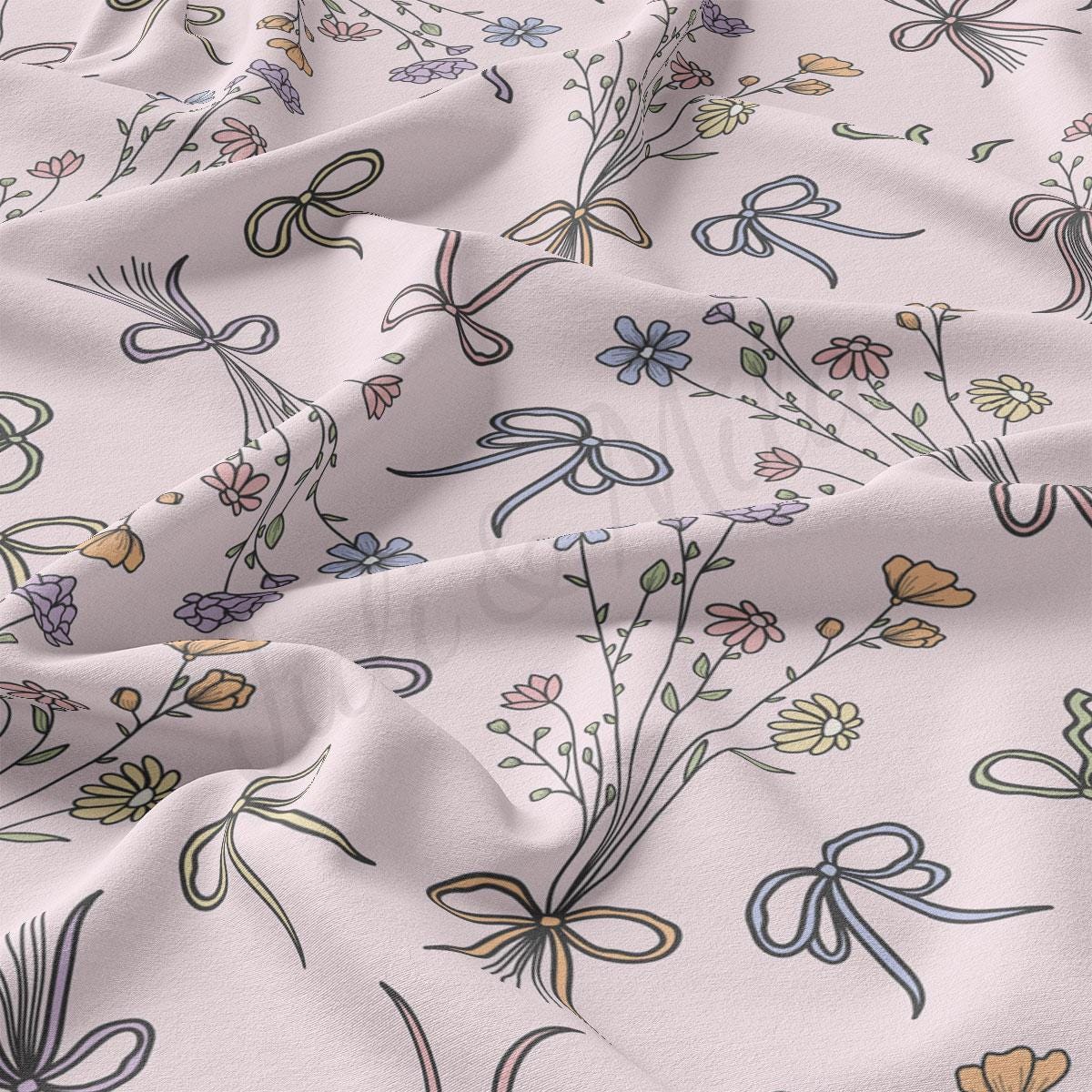 a close up of a white fabric with flowers on it