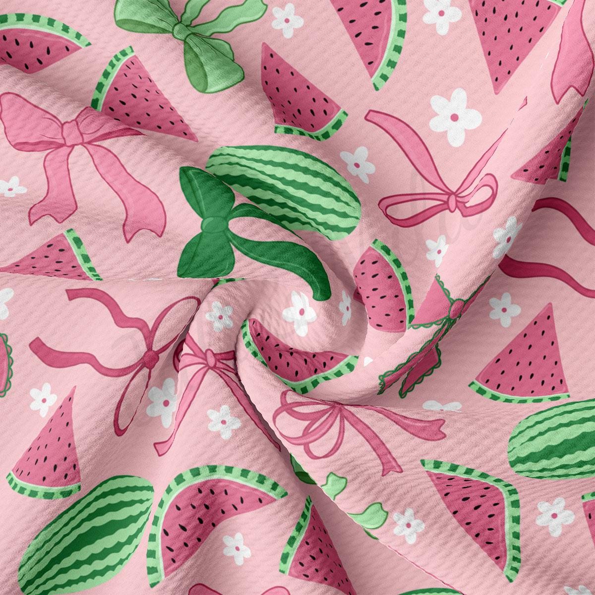 a close up of a pink fabric with watermelon designs