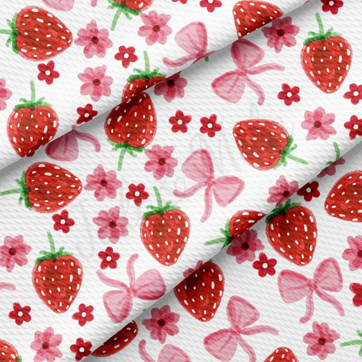 a close up of a fabric with strawberries on it