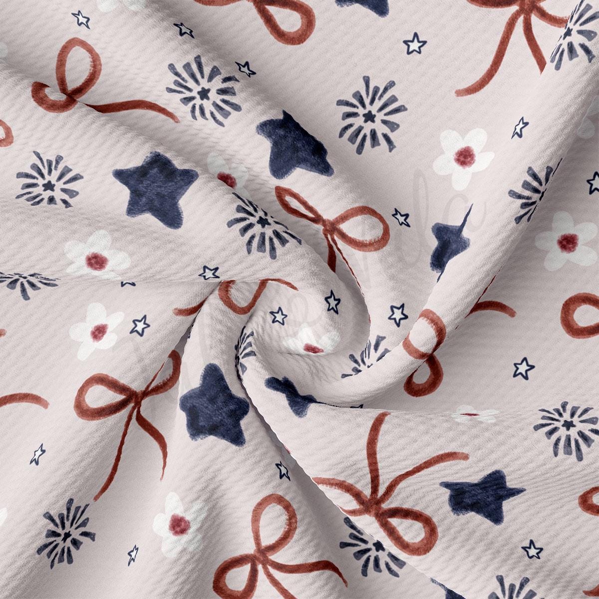 a white fabric with red, white and blue bows