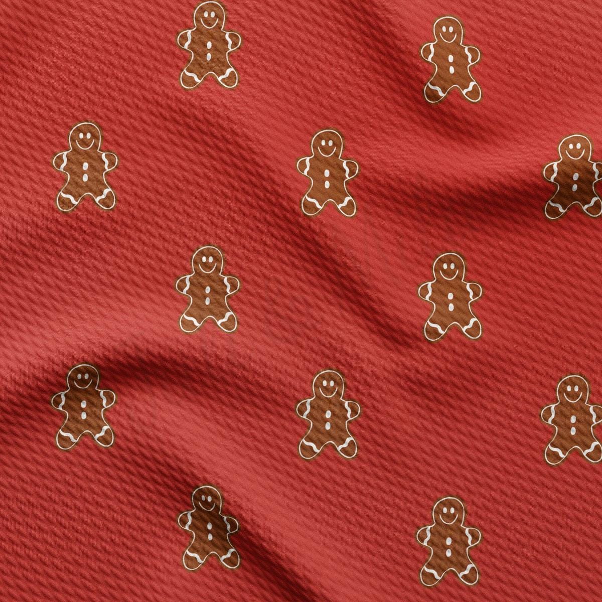 a close up of a red fabric with a pattern of a gingerbread man