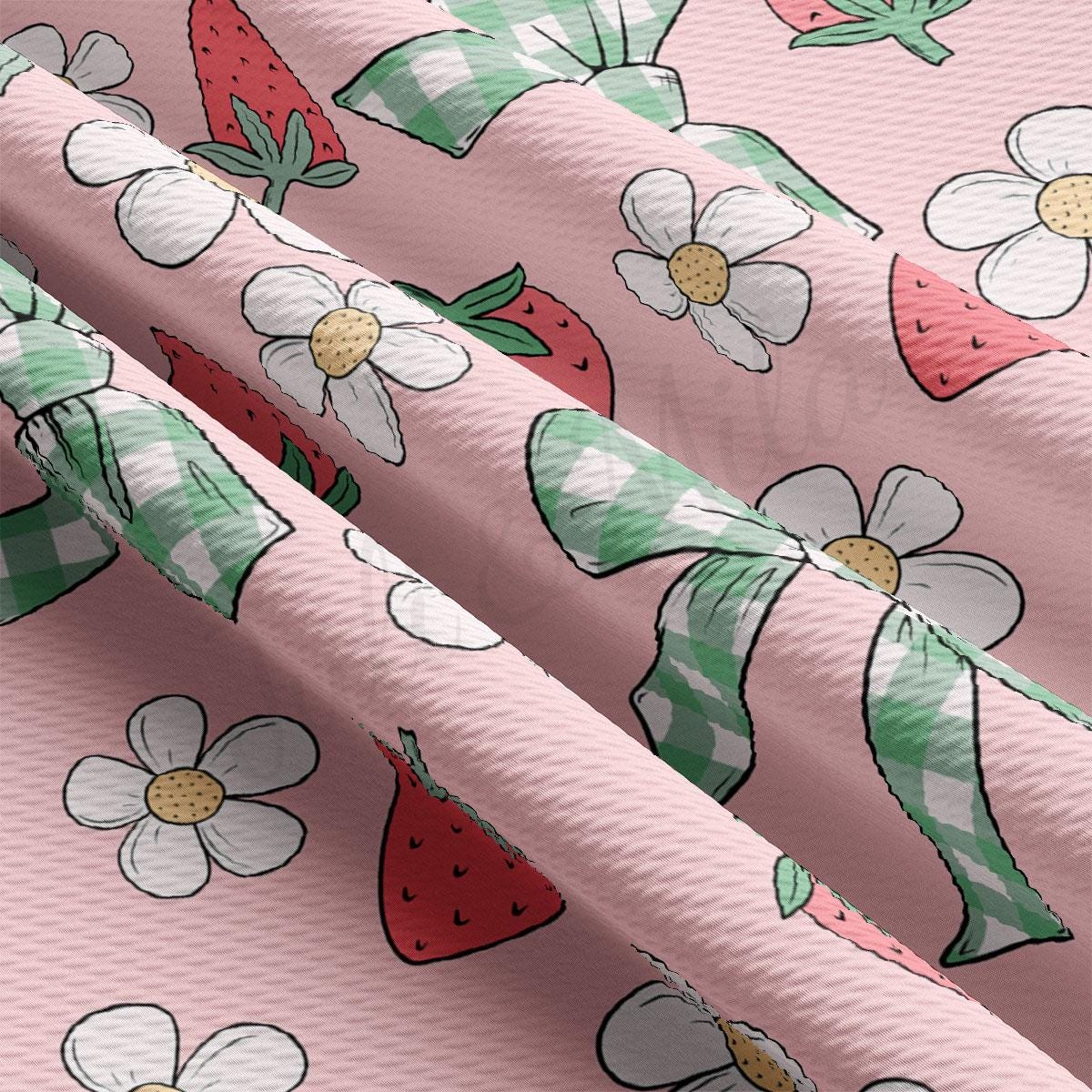a close up of a pink background with flowers and strawberries