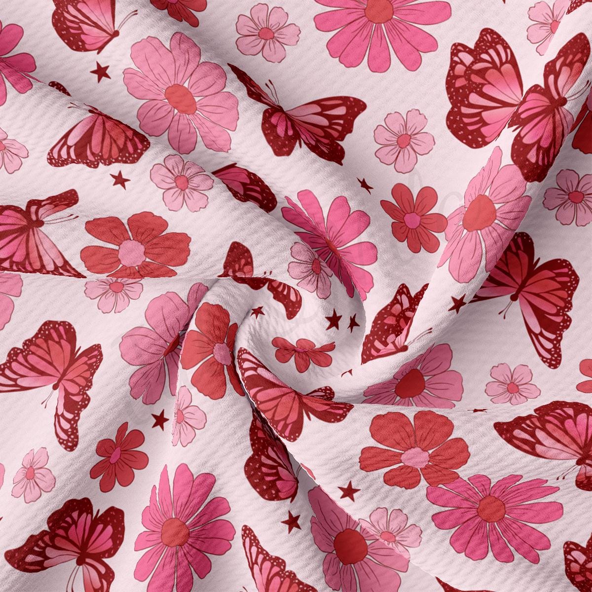a pink and red flower and butterfly print fabric