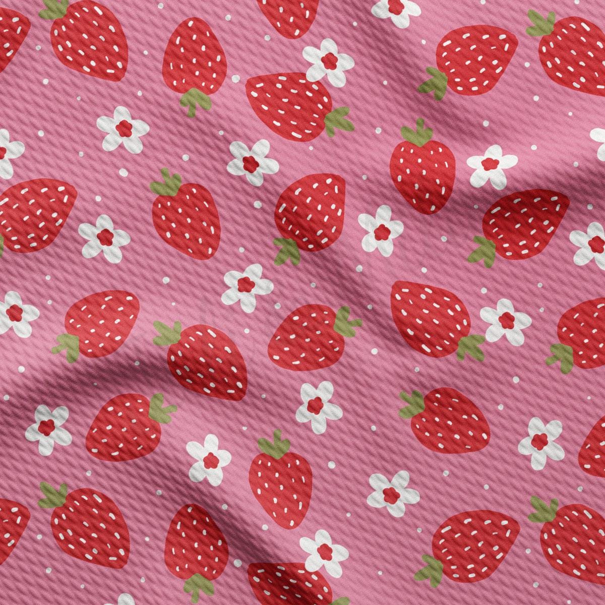a pink background with strawberries and flowers