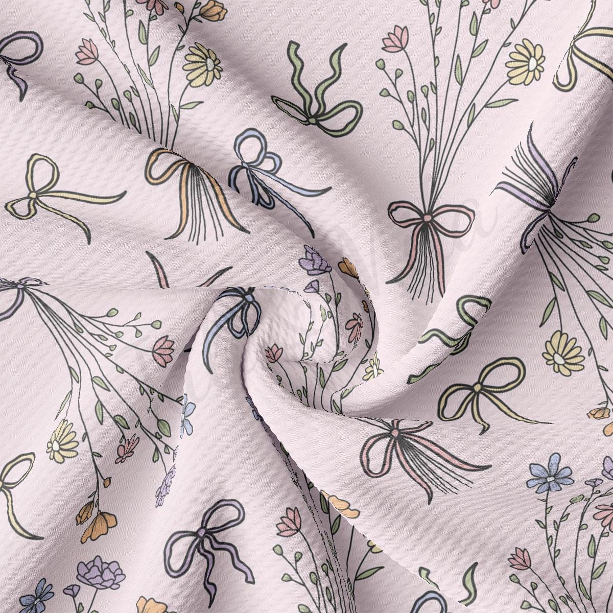 a close up of a white fabric with a flower pattern