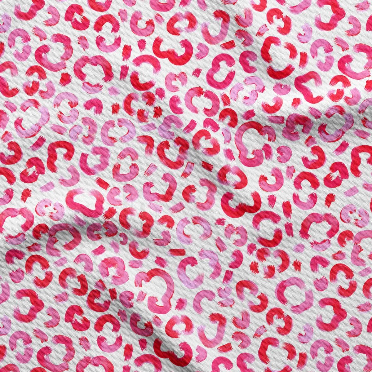 a red and pink animal print fabric