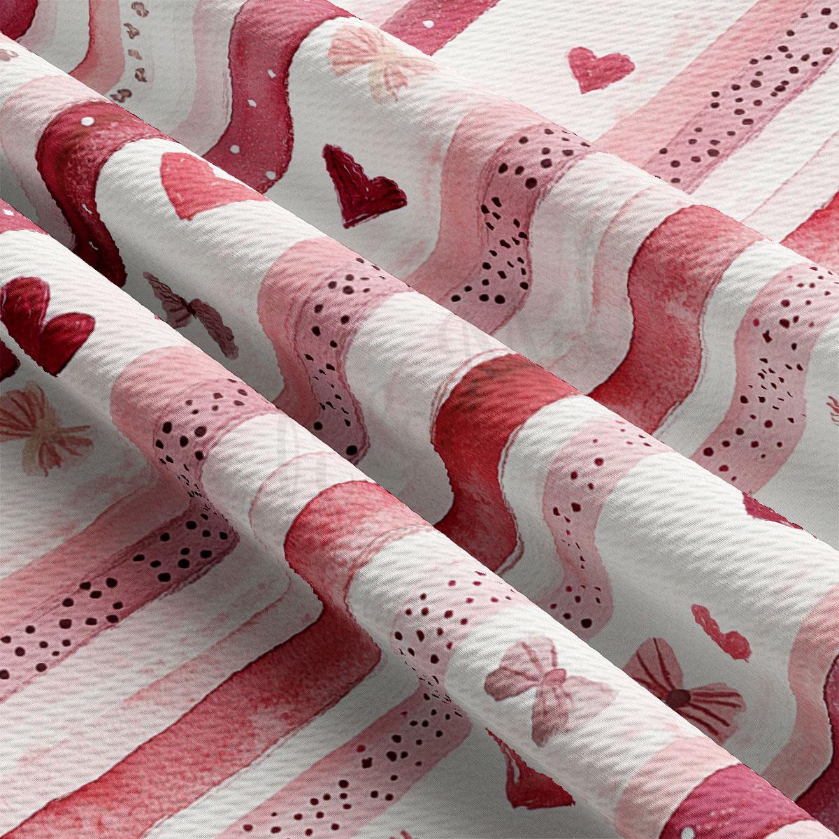 a close-up view of a fabric with a repeating pattern of pink and white stripes, hearts, and bows.