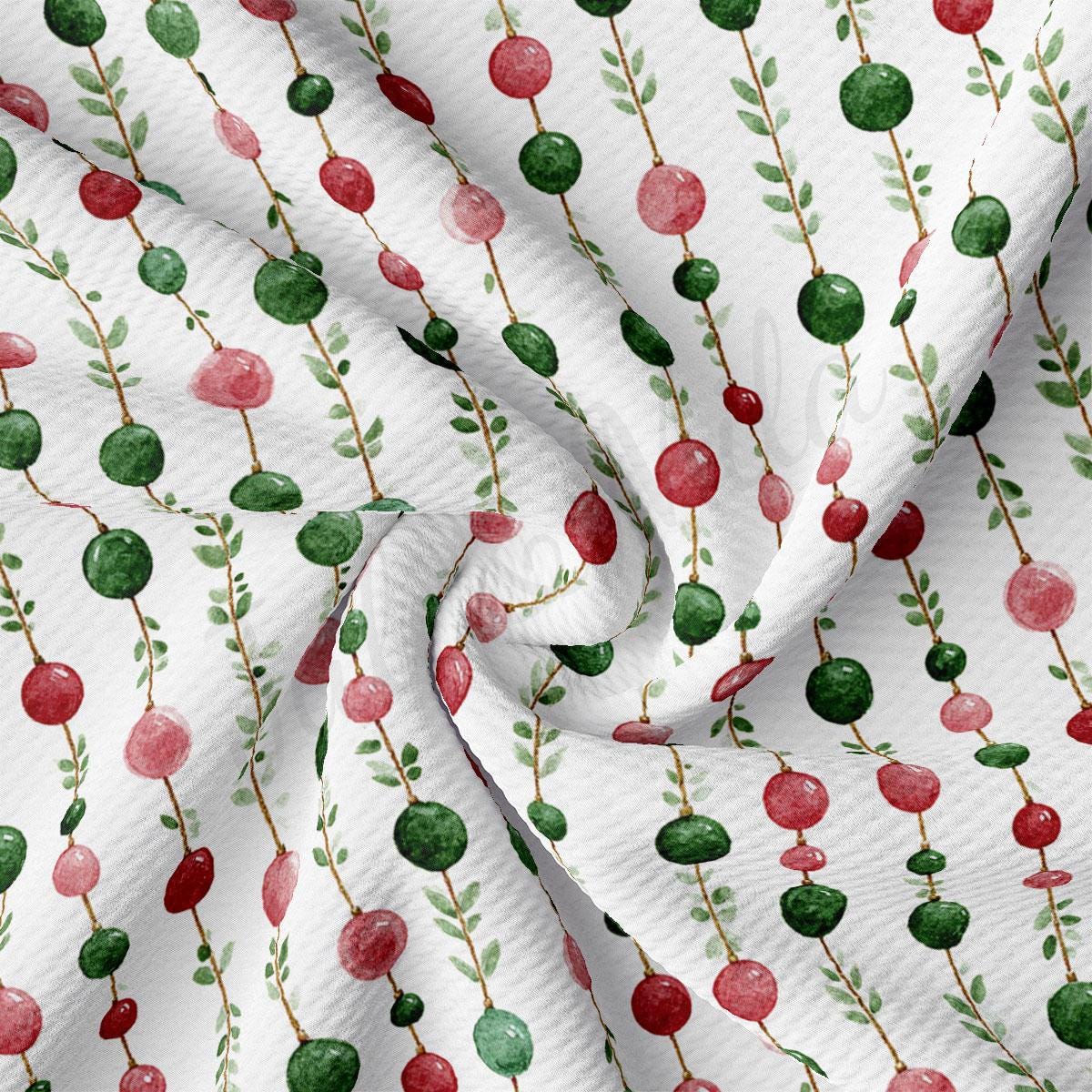 a close-up view of a fabric with a repeating pattern of red and green circles and green leaves.