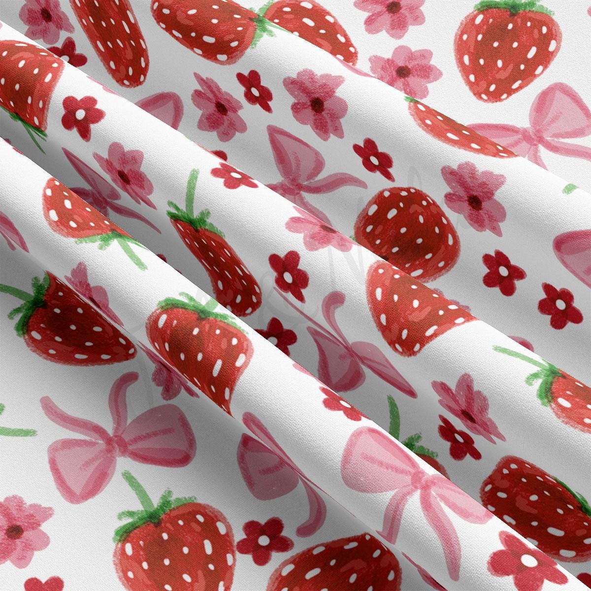 a close up of a strawberry print curtain