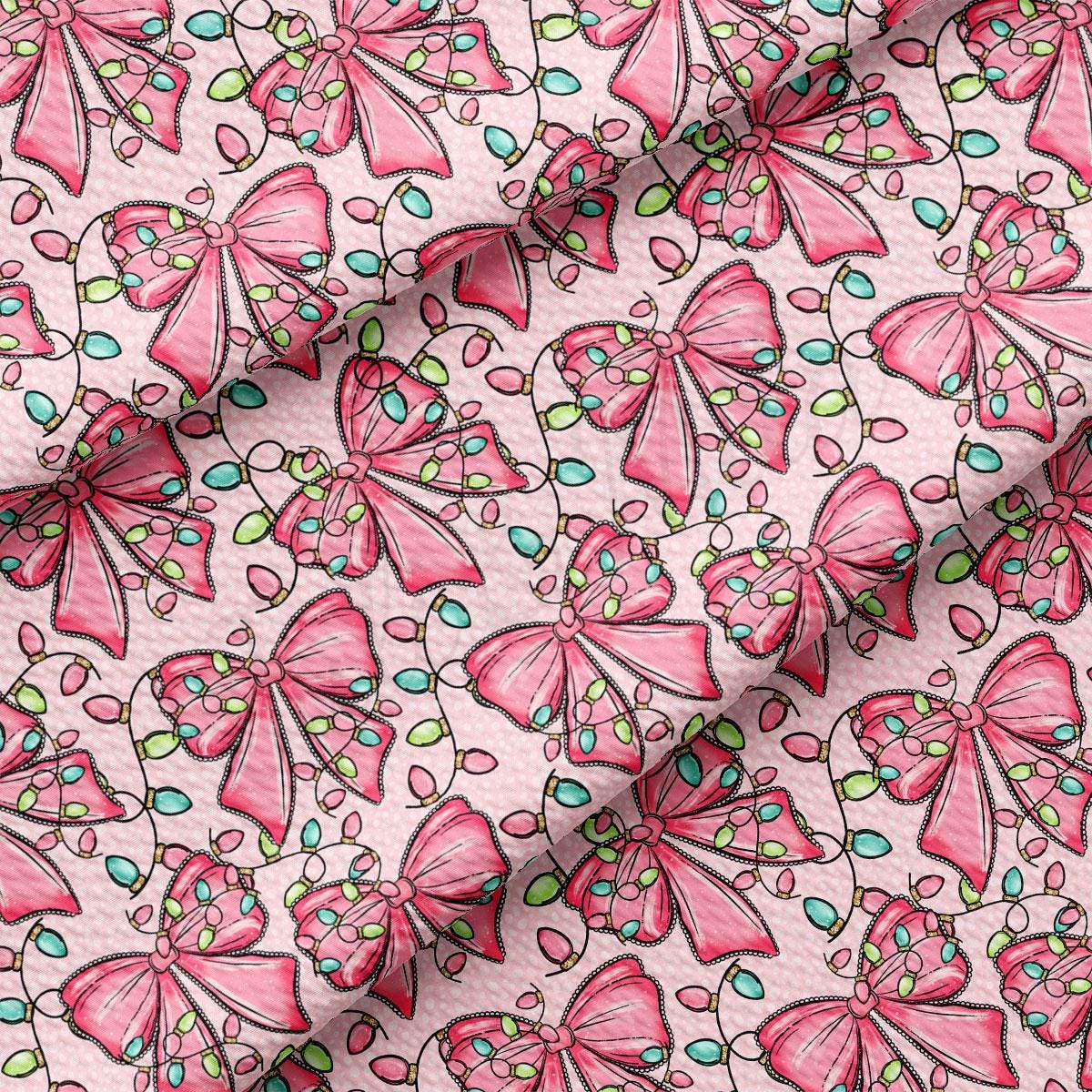 a repeating pattern of pink bows with green and blue lights, creating a festive and whimsical design.