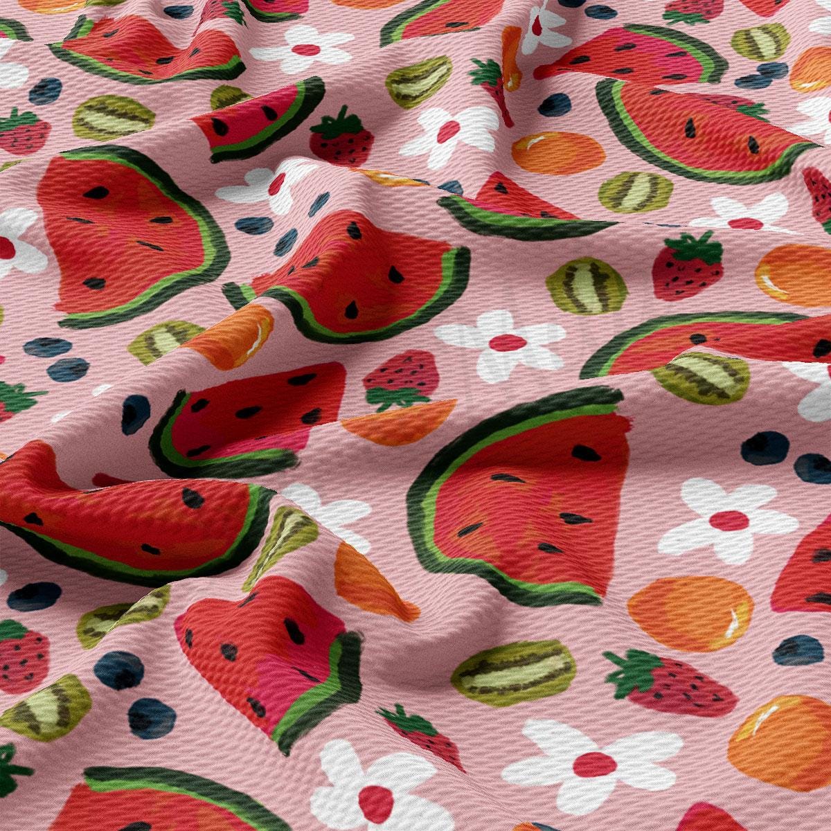 a close up of a pink fabric with watermelon on it