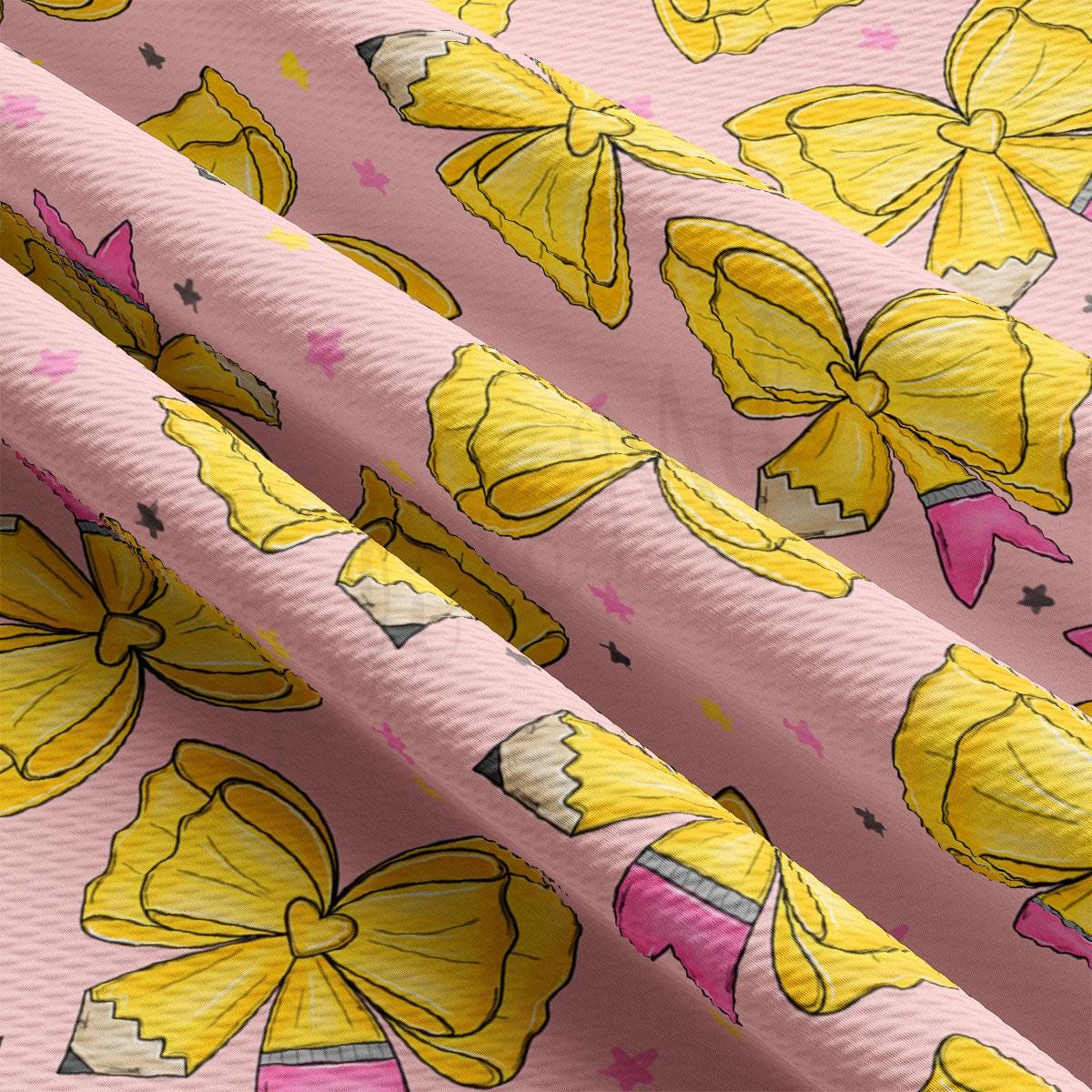 a close-up view of a fabric with a repeating pattern of yellow pencils and flowers on a pink background.