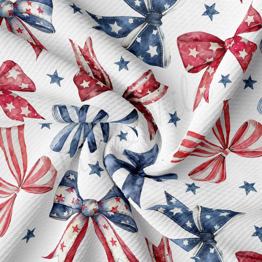 a red, white and blue pattern of bows and stars