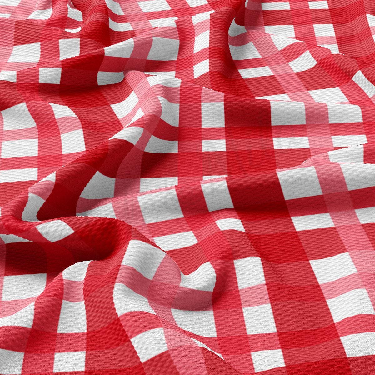 a red and white checkered fabric with a red circle