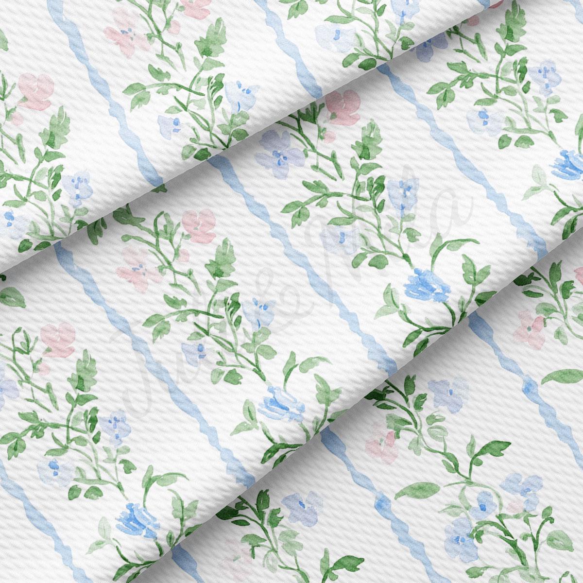 a repeating pattern of green leaves and pink flowers on a white background, creating a visually appealing and harmonious design.