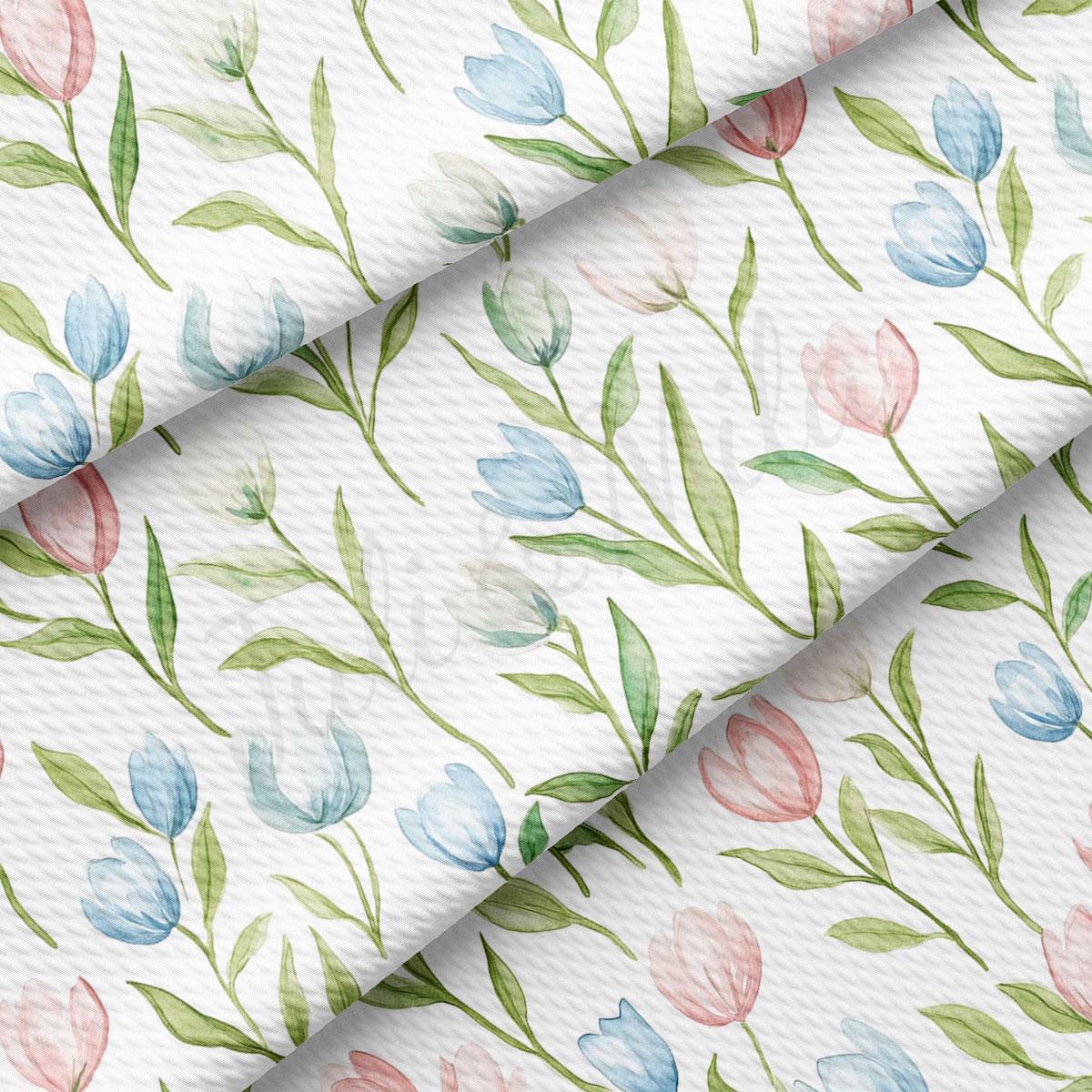 a repeating pattern of blue, pink, and white flowers with green leaves on a white background.