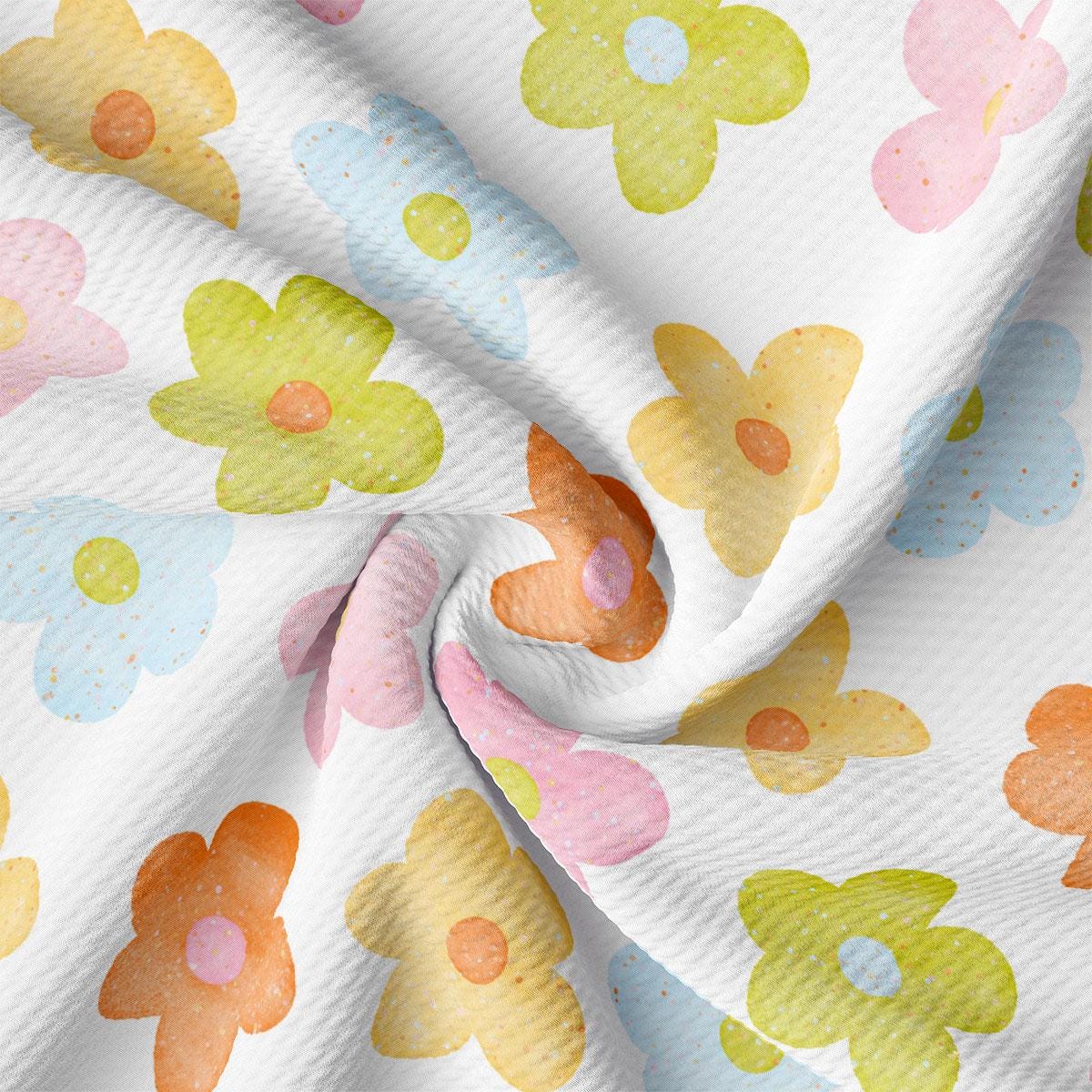 a white fabric with colorful flowers on it