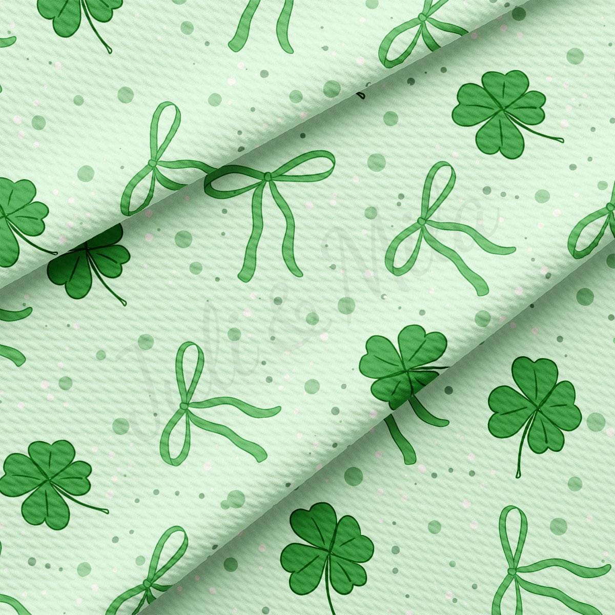 a green shamrock pattern on a white background