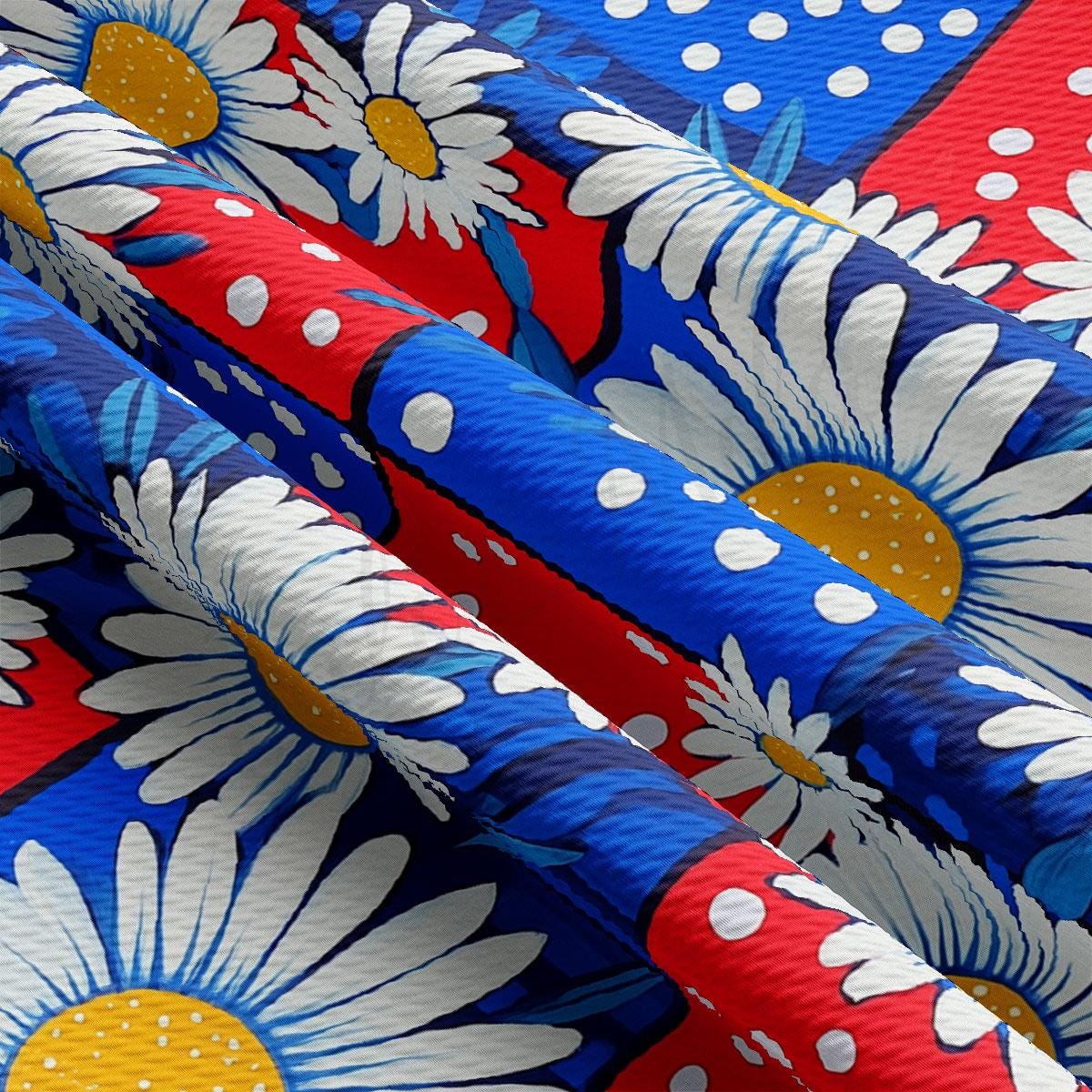 a blue, red, and white fabric with flowers on it