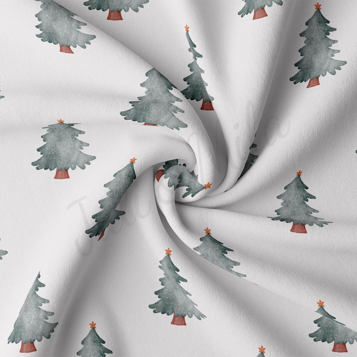 a close up of a white fabric with trees on it