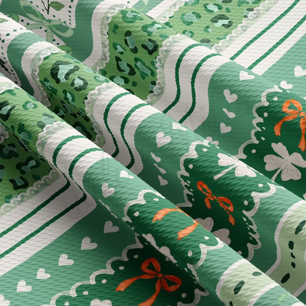 The image is a close-up view of a fabric with a repeating pattern of green and white stripes, along with various animal prints and floral designs.