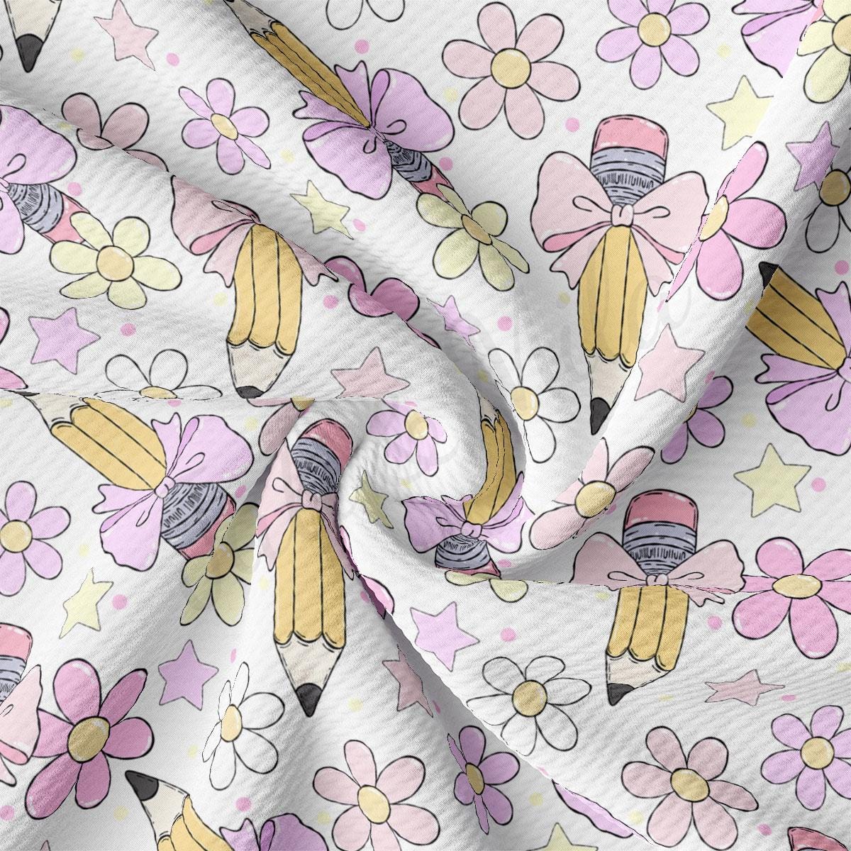 a white fabric with pink and yellow flowers on it