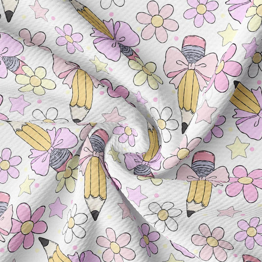 a white fabric with pink and yellow flowers on it