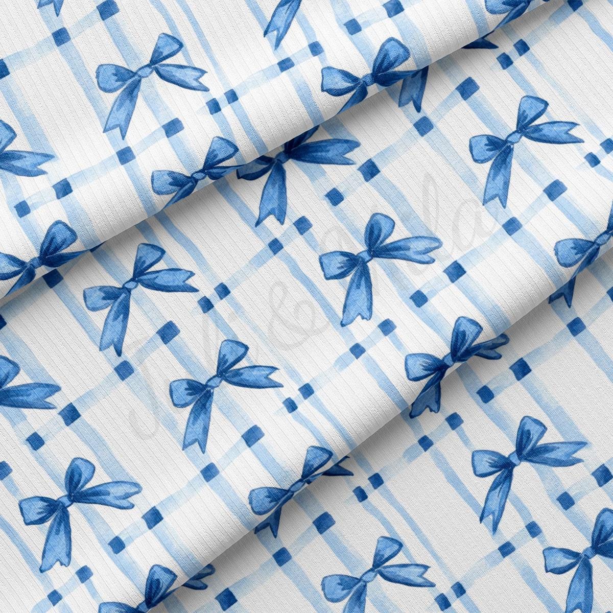 a blue and white checkered fabric with blue bows