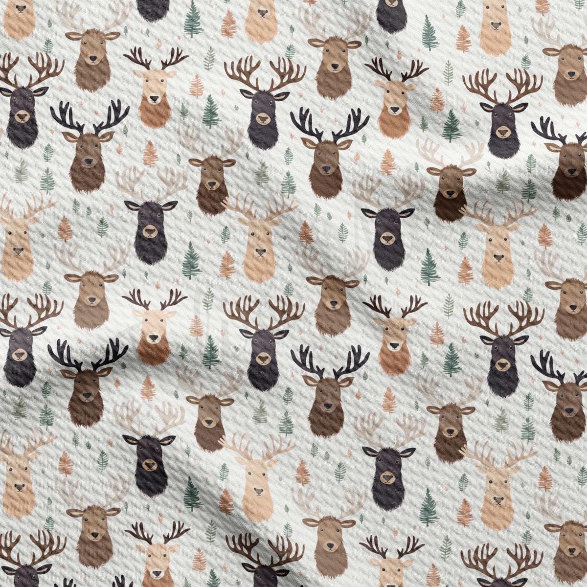 a pattern of deer heads on a white background