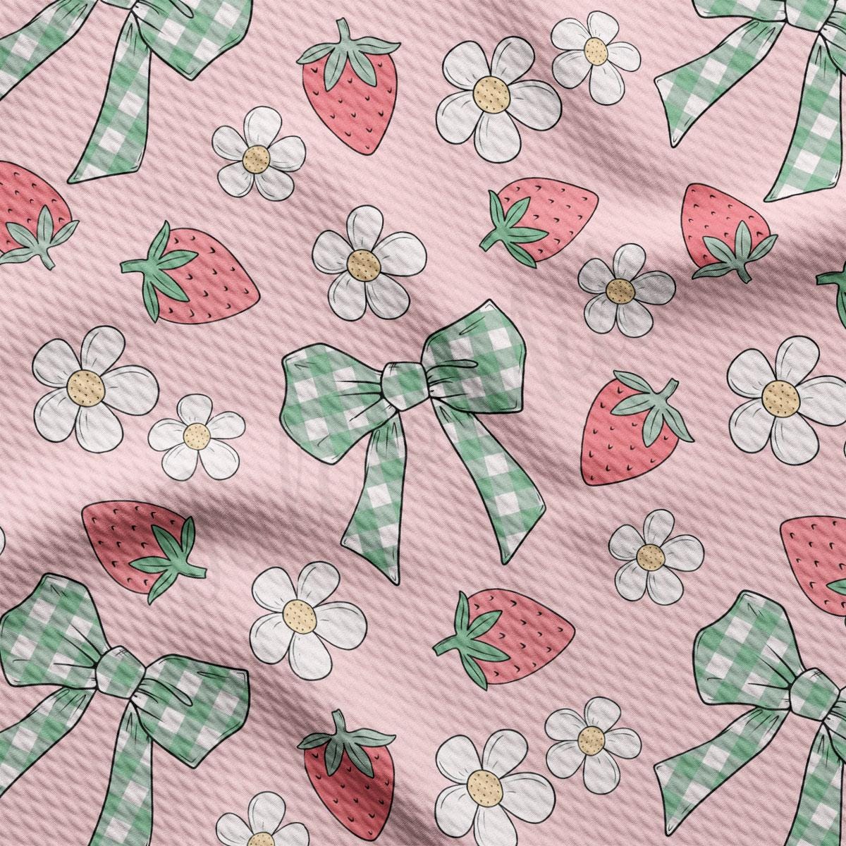 a pattern of bows and flowers on a pink background