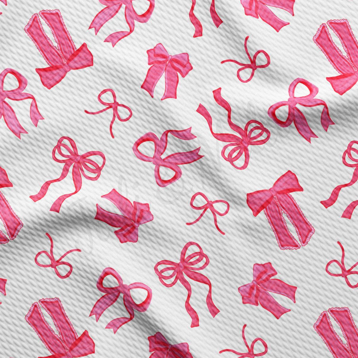 a pattern of pink bows and scissors on a white background