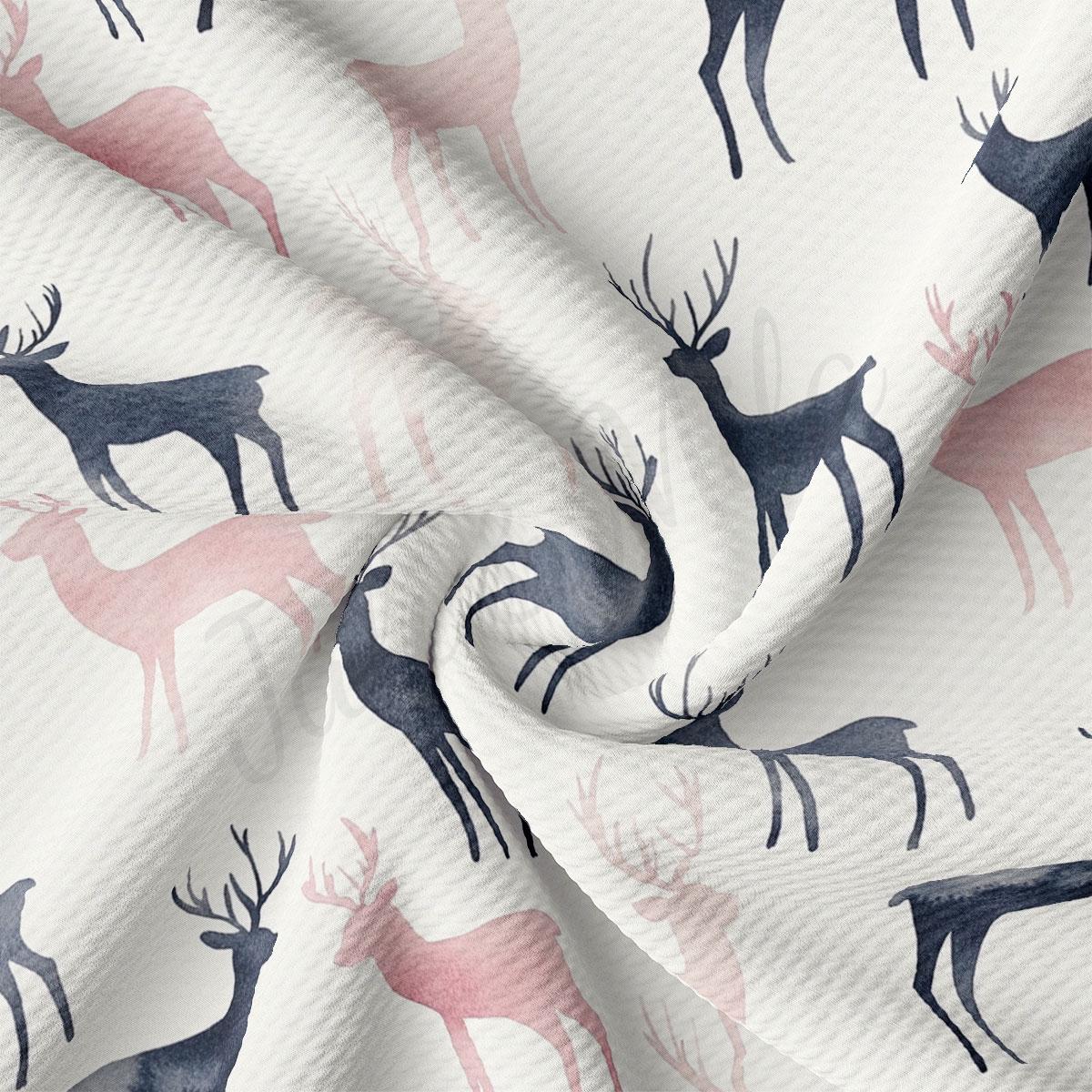 a close-up view of a fabric with a repeating pattern of deer silhouettes in shades of pink and black.