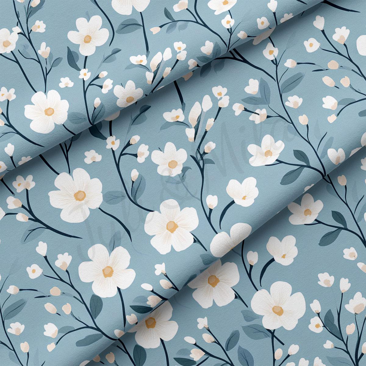 a repeating pattern of white flowers with green leaves against a light blue background.