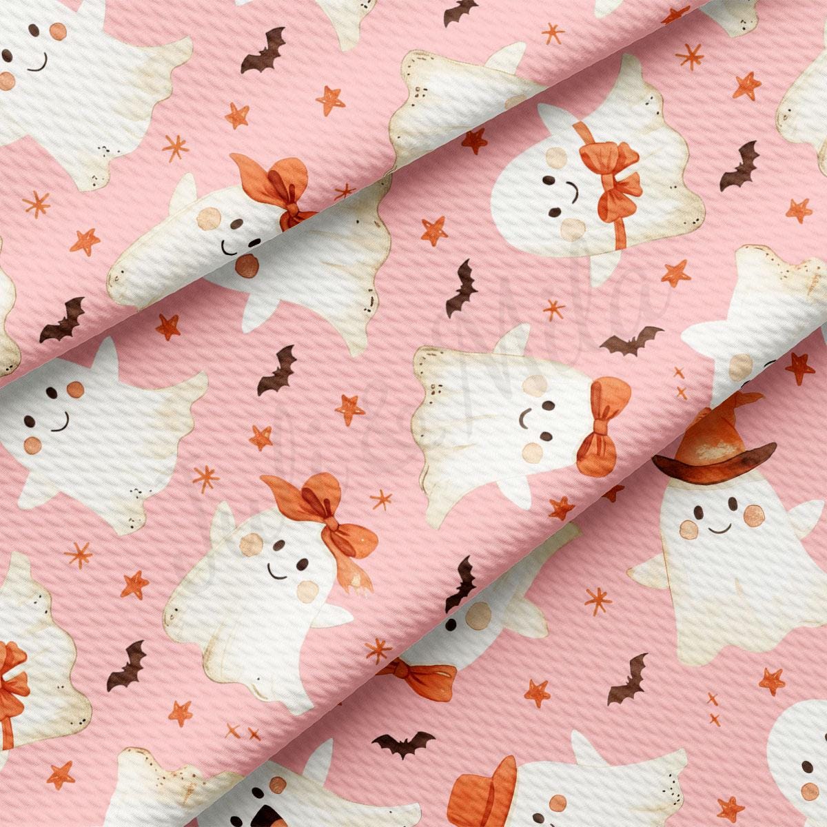 a repeating pattern of white ghost characters with orange bows and bats against a pink background.