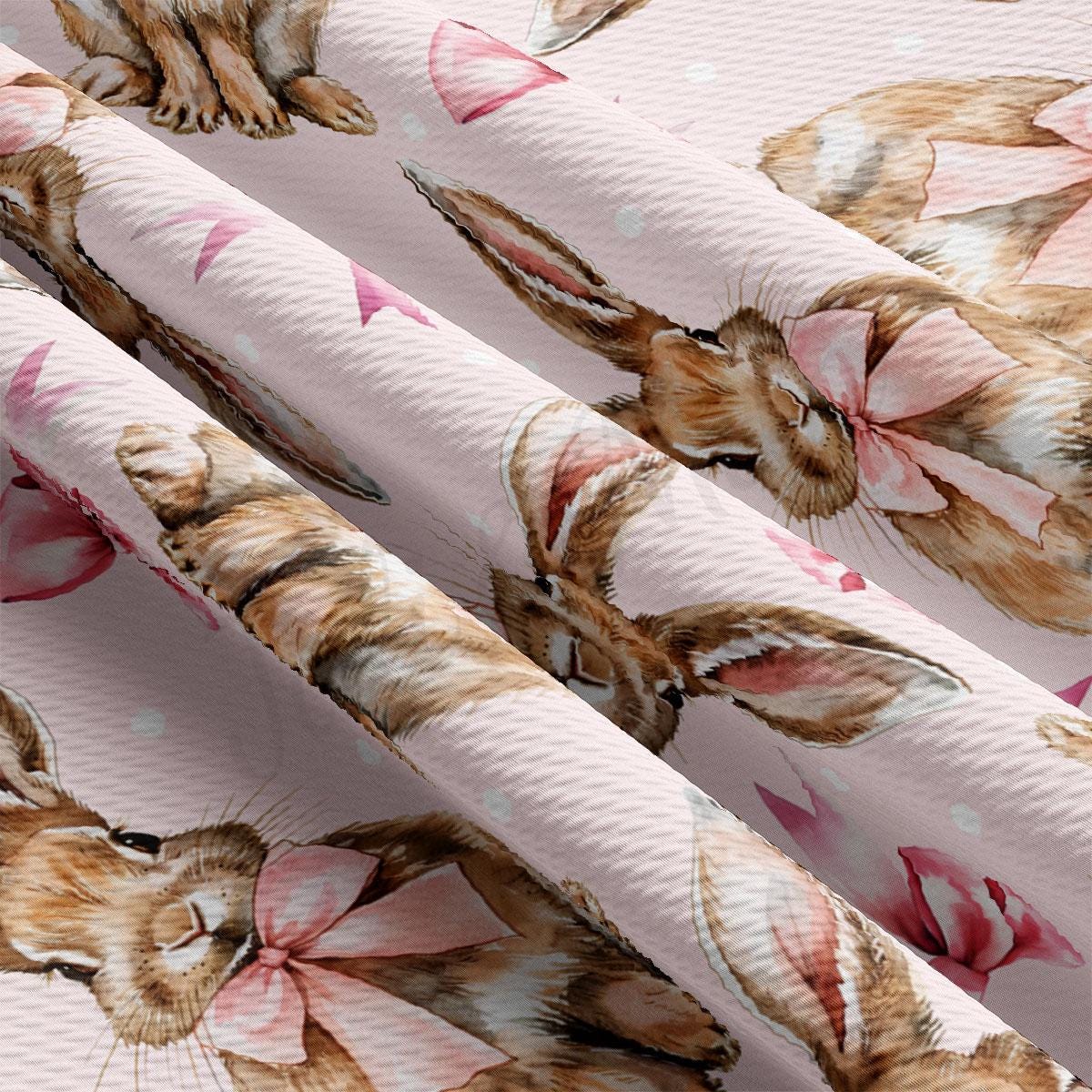 a cat with a bow on a pink background