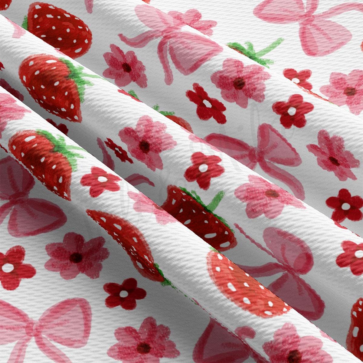 a close up of a strawberry print curtain