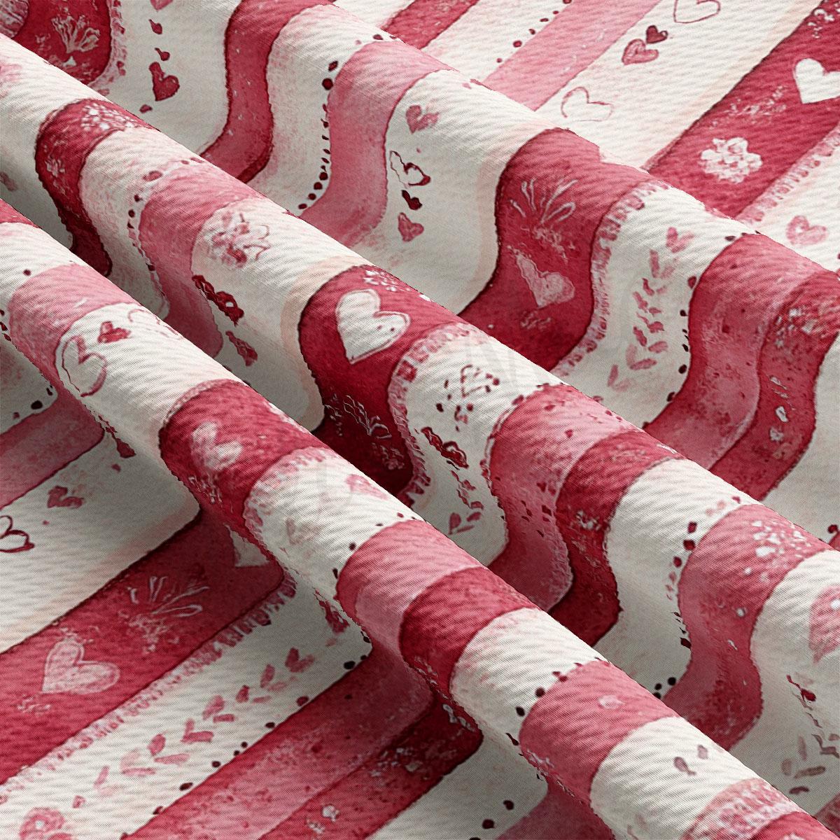 The image is a close-up view of a fabric with a repeating pattern of pink and white stripes, along with small heart shapes and floral designs.