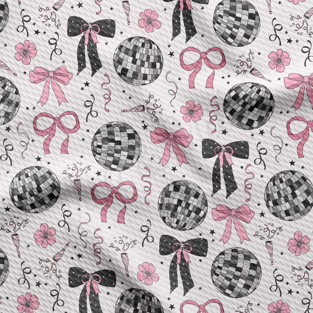 a pattern of black and white balls and bows