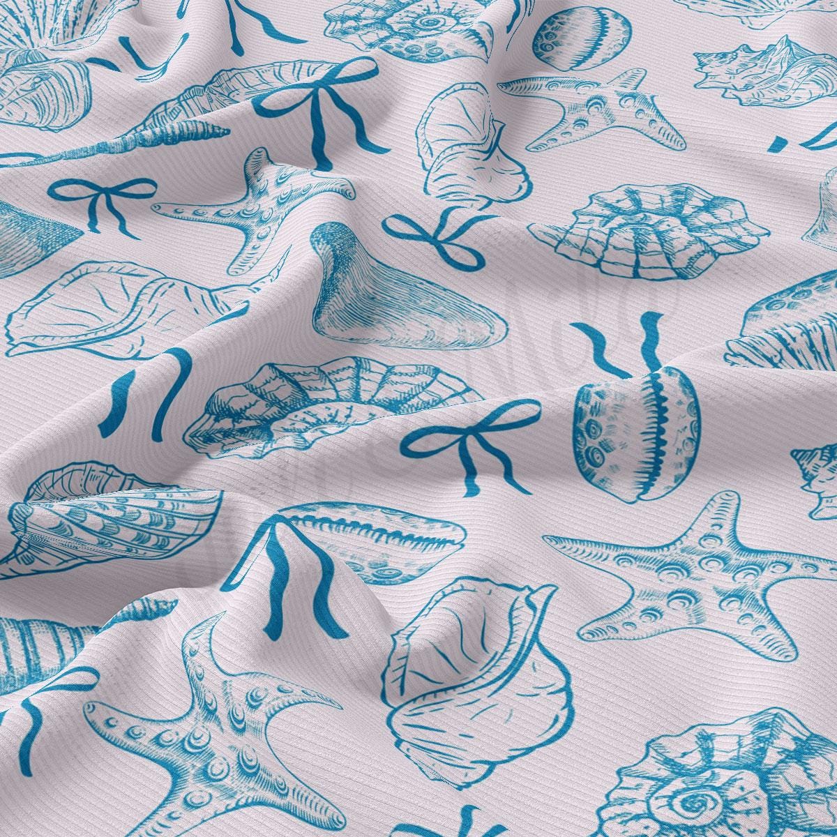 a close up of a blue and white pattern on a fabric