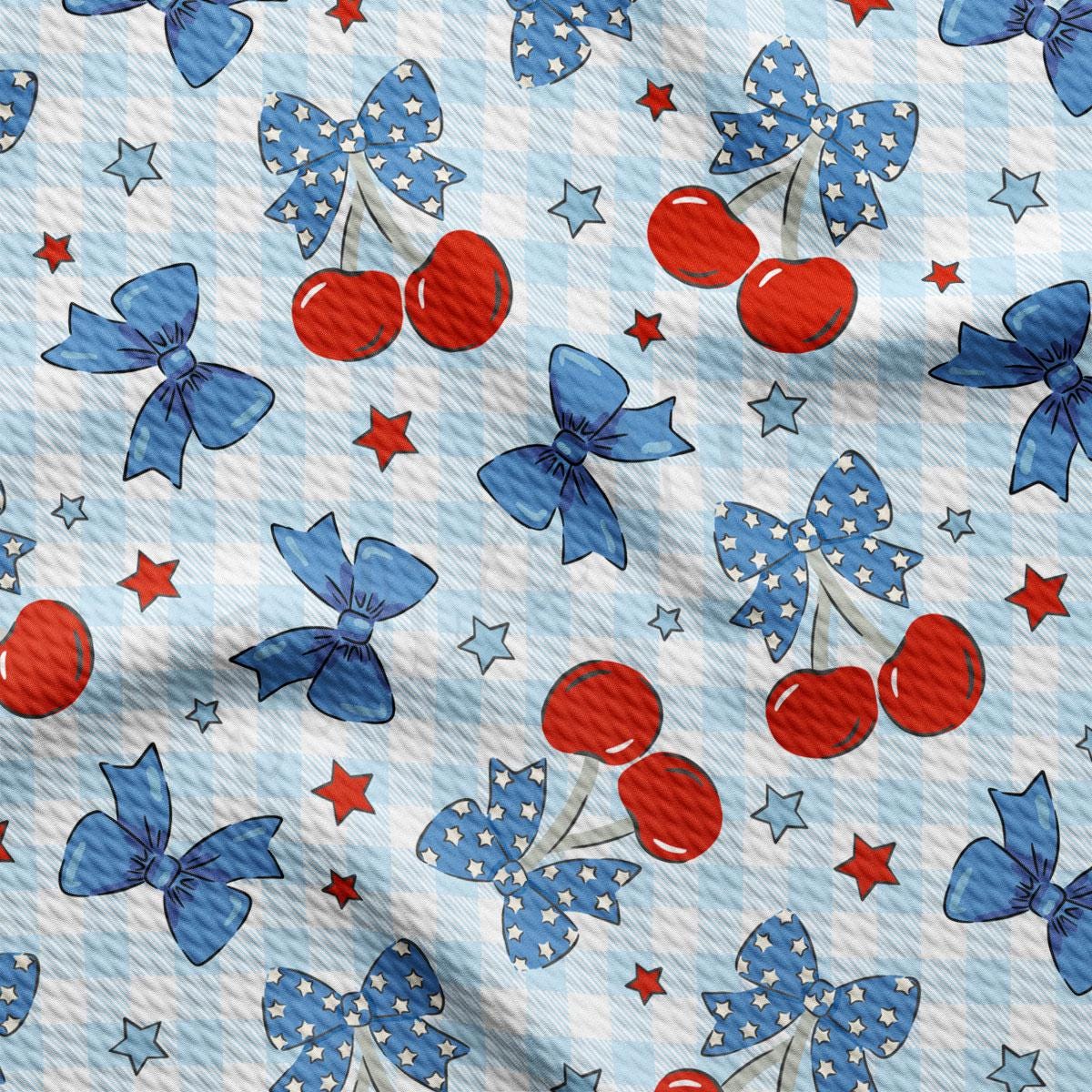 a pattern of red, white, and blue bows and cherries