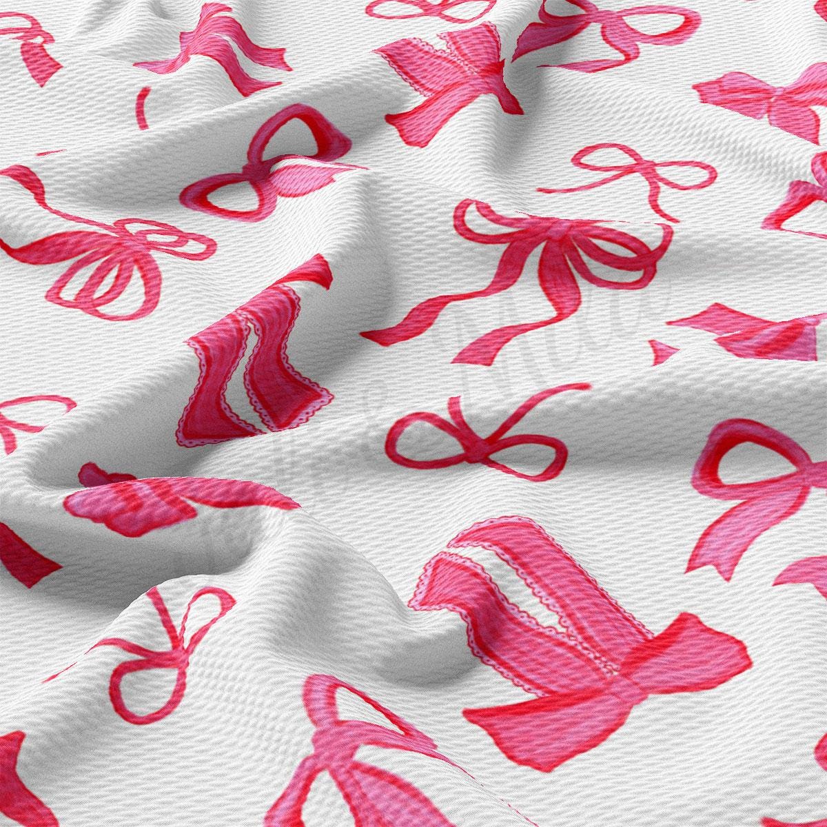 a close up of a pink and white fabric