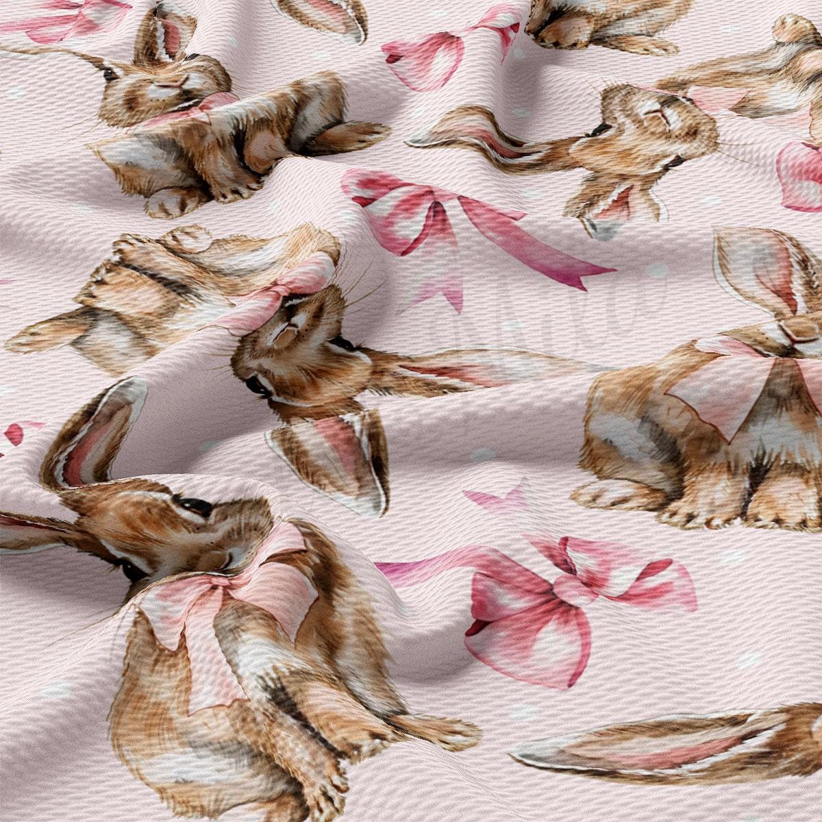 a pink and brown dog with a pink bow on a pink background