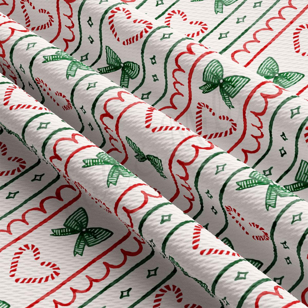 a close-up view of a fabric with a repeating pattern of red and green stripes, green bows, and red and white candy canes.
